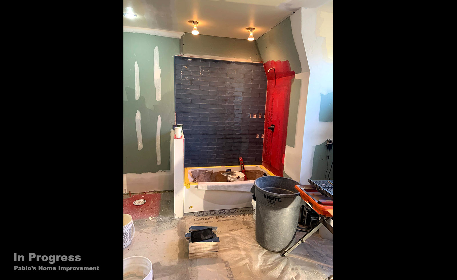 bathroom-renovation-teal-tile-dark-floor-inprogress2